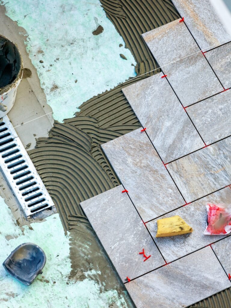 Laying garden paving with all the tools necessary for the tiler.