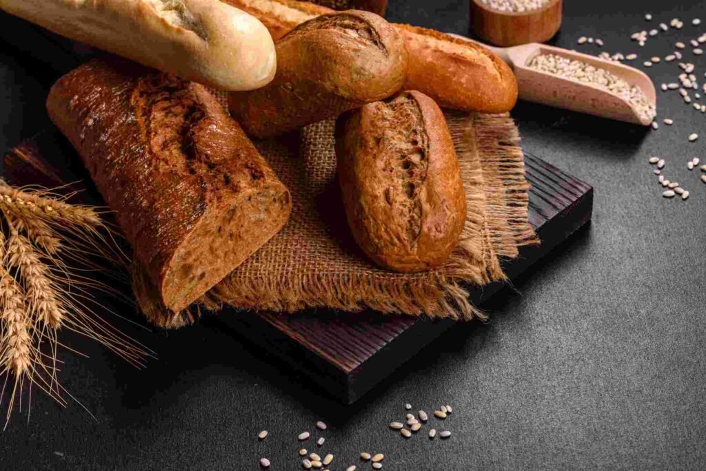 fresh-bread-on-black-background-top-view-copy-space